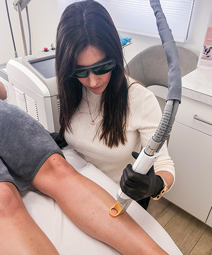 Nurse Kristin performing Laser Hair Removal