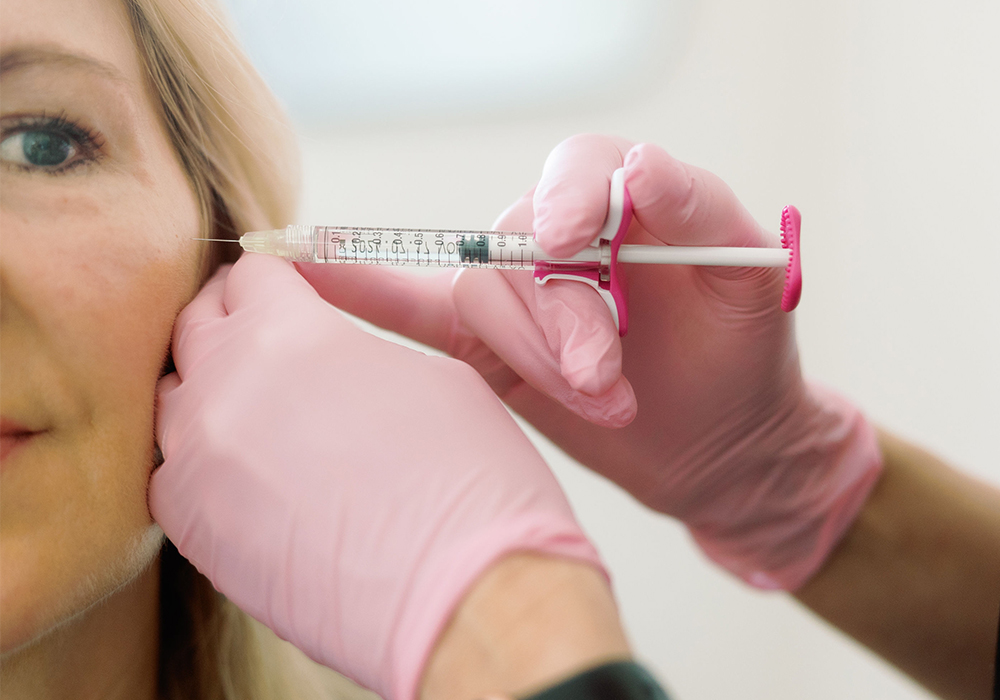 Woman receiving facial injectables at Orange County medical spa