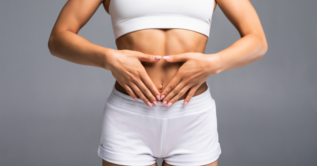 a woman showcasing her perfect abdomen