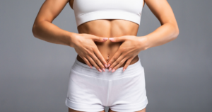 a woman showcasing her perfect abdomen