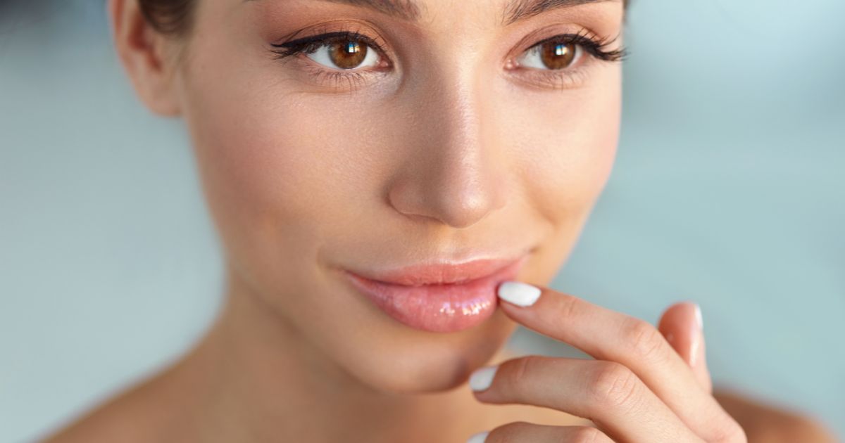 A woman is feeling happy with her lips after being injected with lip fillers in San Clemente, CA.
