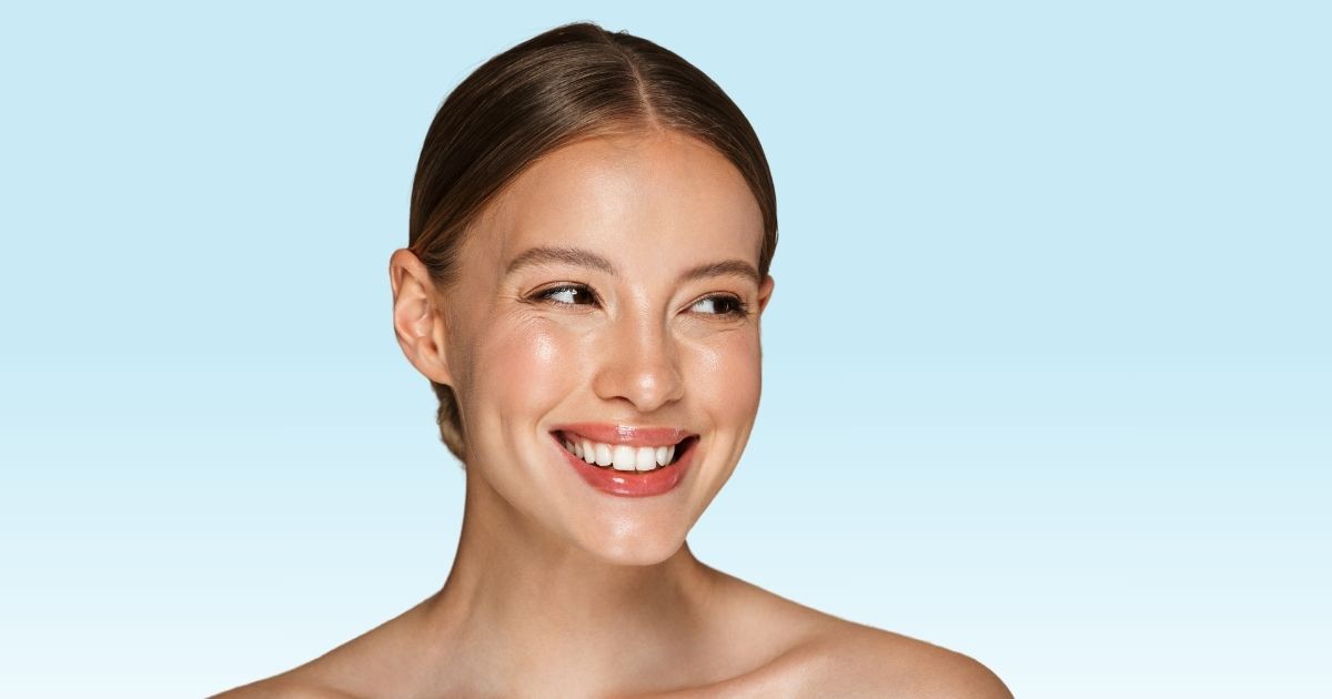 A beautiful woman's happy face promotes Restylane lip filler injections in San Clemente, CA.